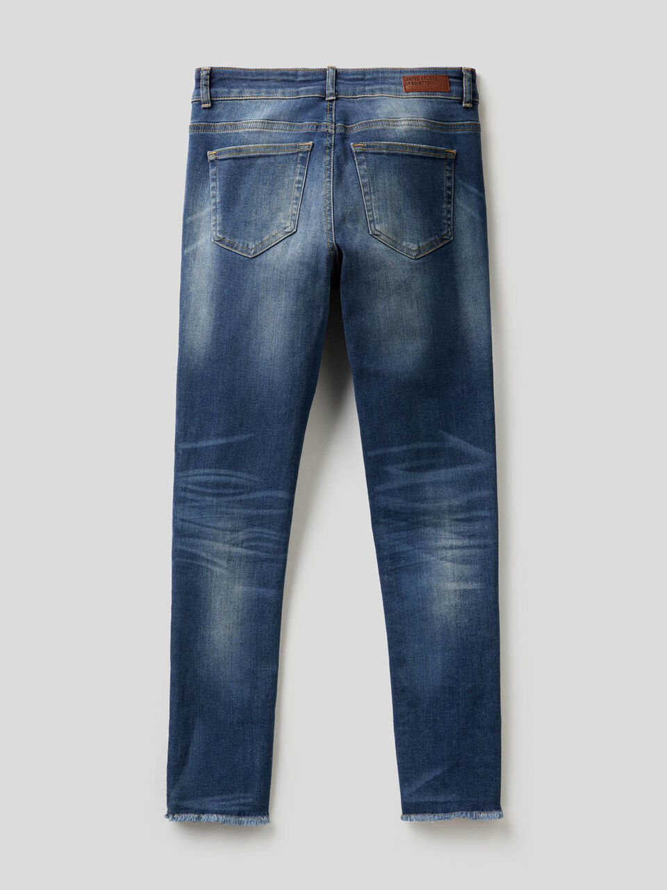 Jeans with frayed bottom image number 2