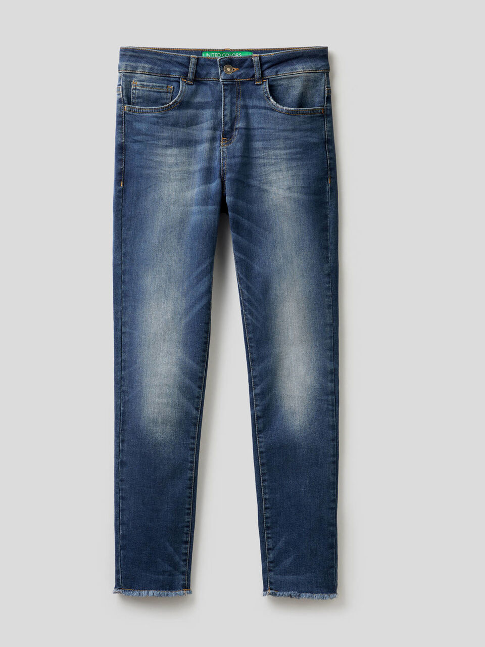 Jeans with frayed bottom image number 1