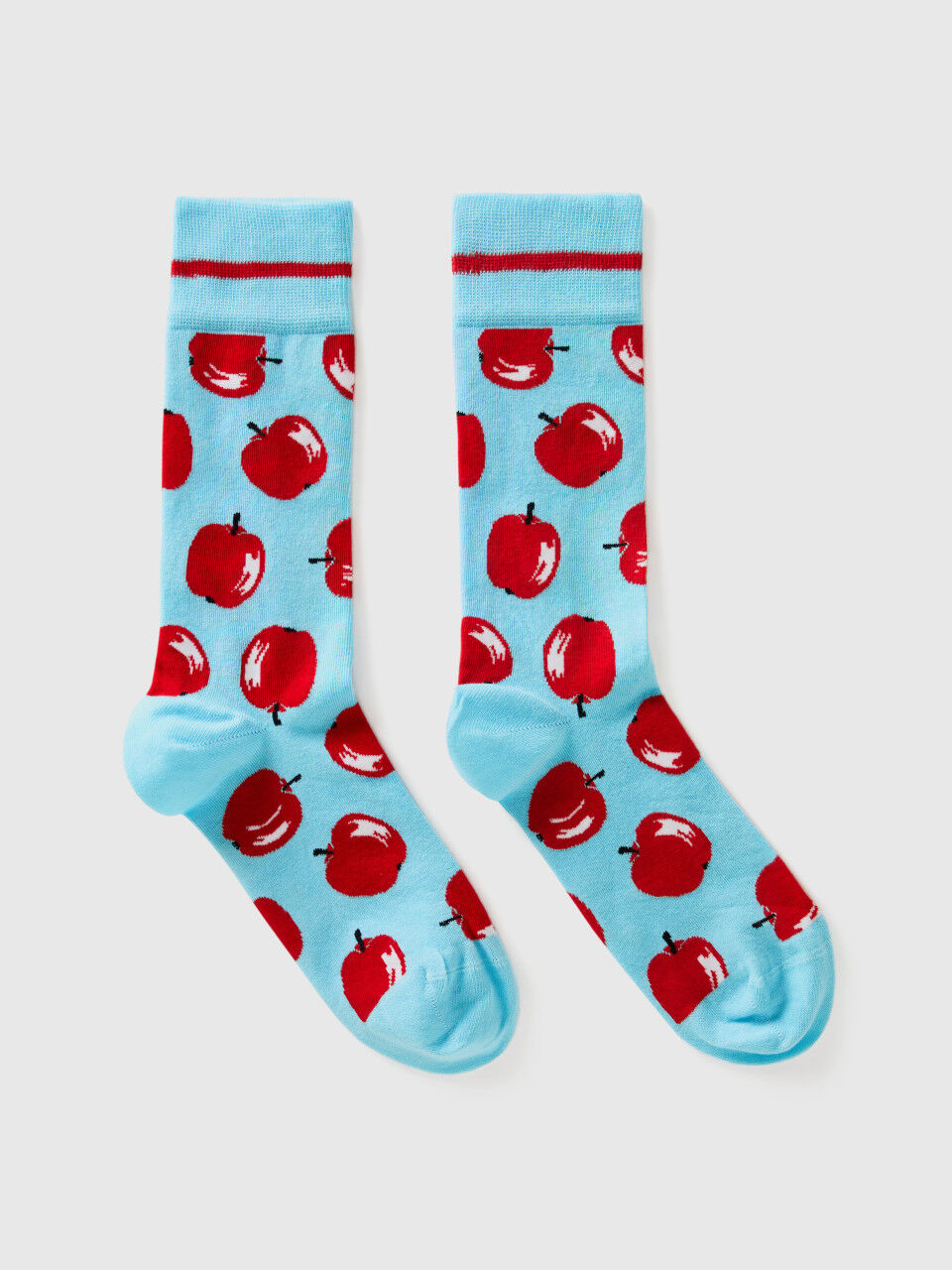 Light blue socks with apple pattern