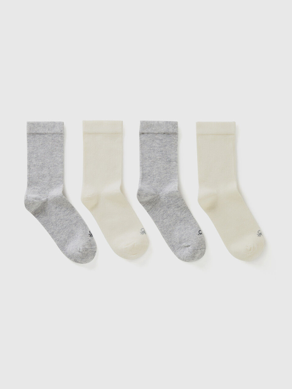 Four pairs of white and gray socks