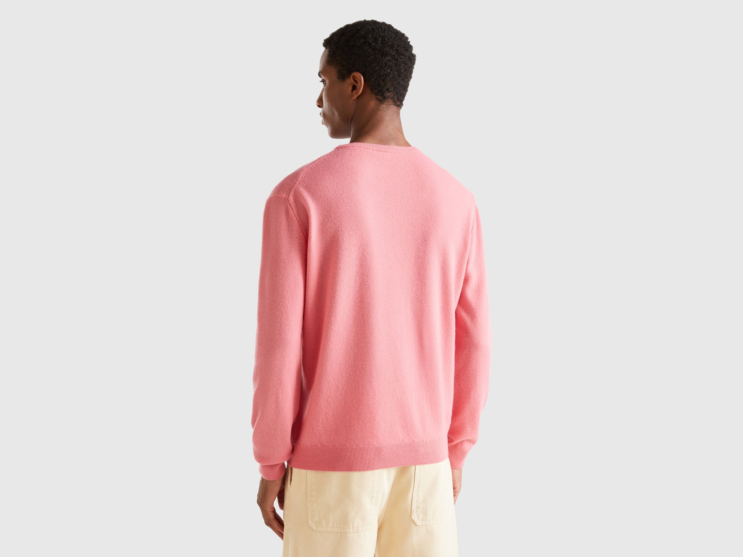 Salmon pink crew neck sweater in pure Merino wool Salmon Benetton