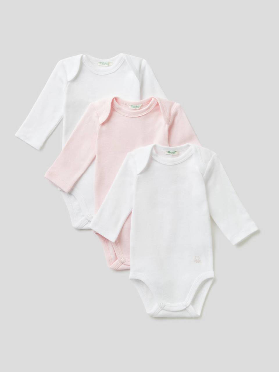 Benetton Three bodysuits in solid color organic cotton. 1